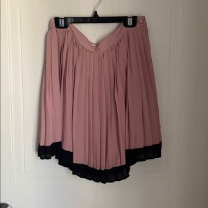 Pink and black pleated skirt